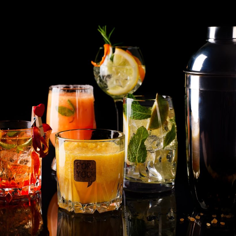 Whiskey-cola cocktail, mojito-cocktail, orange cocktail, strawberry cocktail in glass glasses with